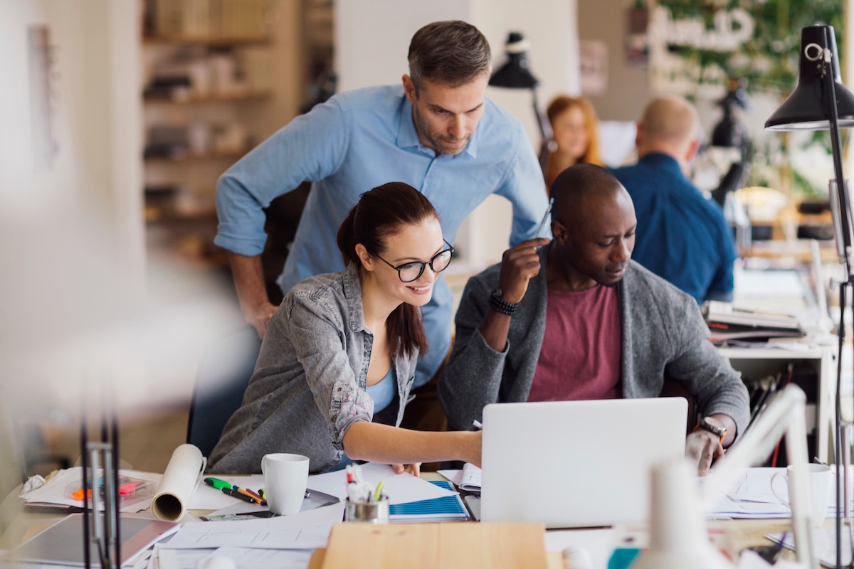 Coworkers working on a project in a startup company office