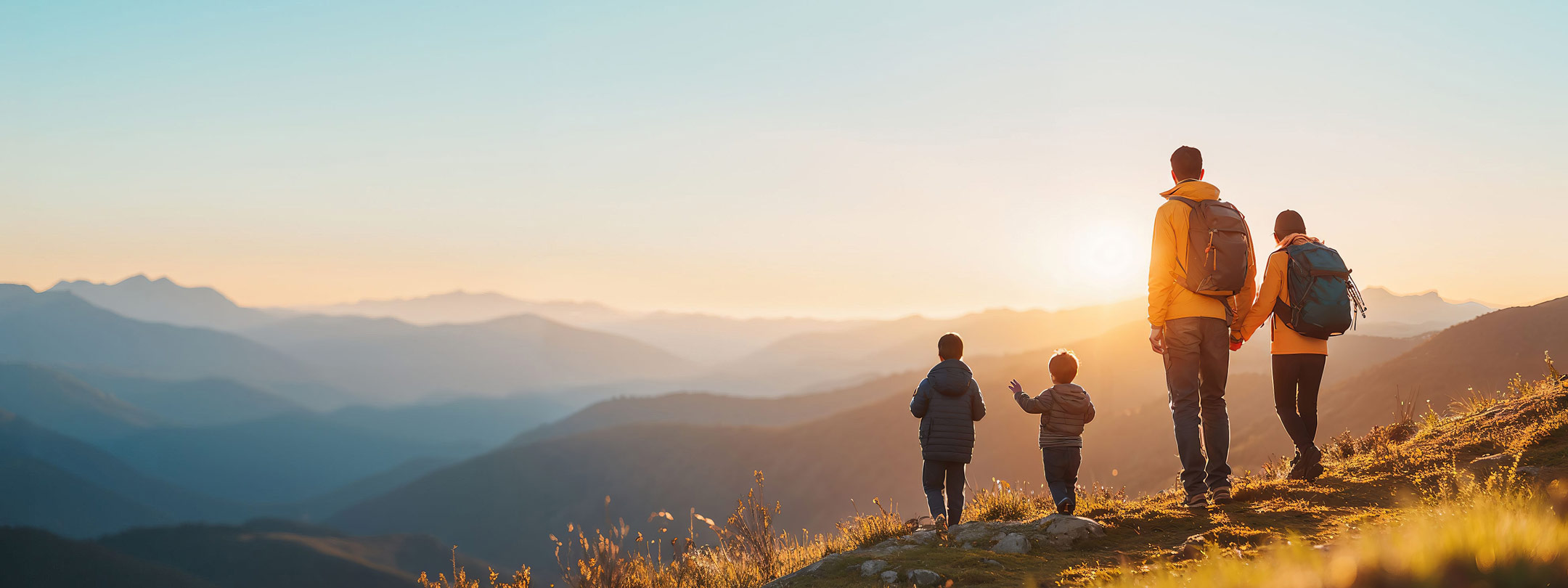 Photo of a small family exploring the mountains.