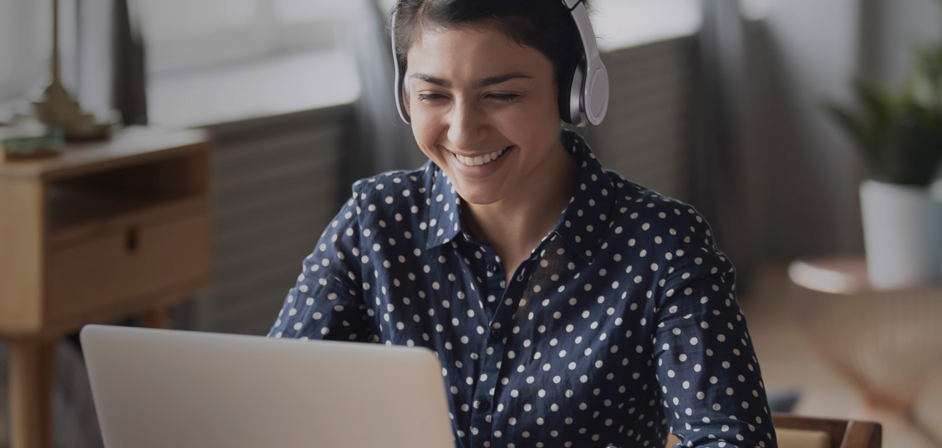 An image of a developer coding on a laptop