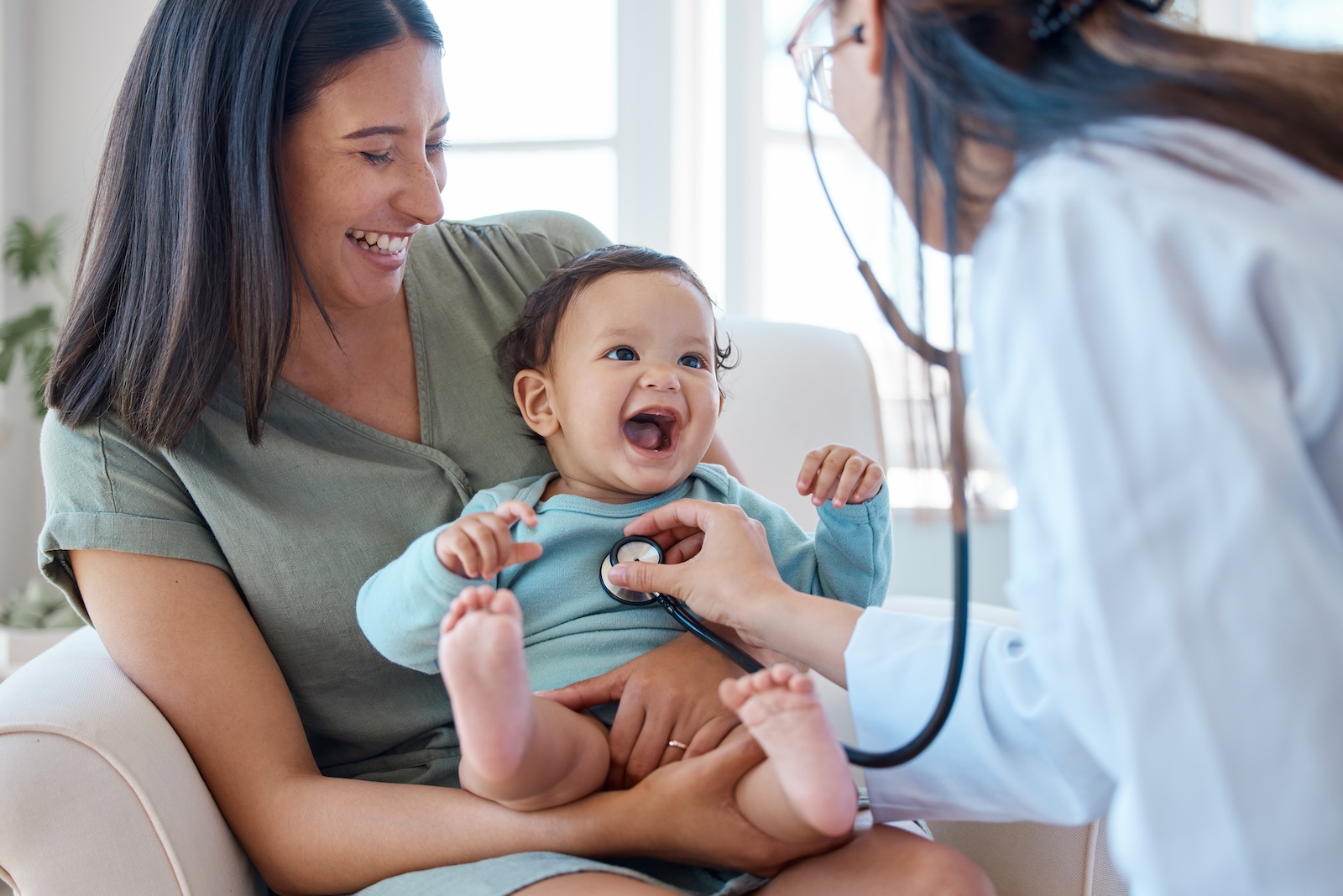 Mother, baby and stethoscope of pediatrician for healthcare consulting, check lungs and breathing for heartbeat. Doctor, happy infant kid and chest assessment in clinic, hospital and medical analysis.
