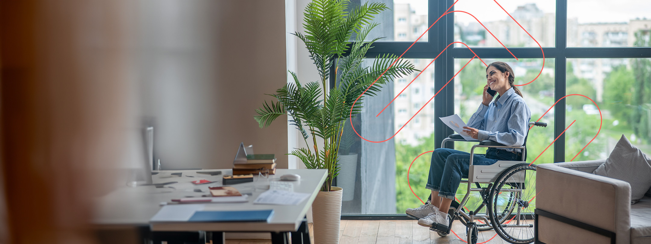 Woman on the phone in wheelchair in an office