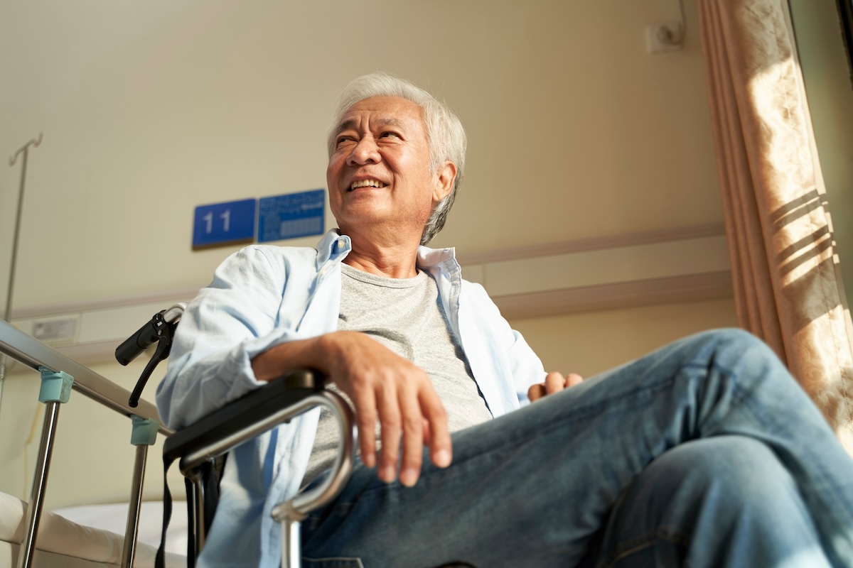 senior man sitting in a wheelchair at a nursing home