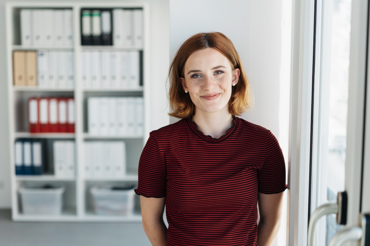 smiling women standing at the office door