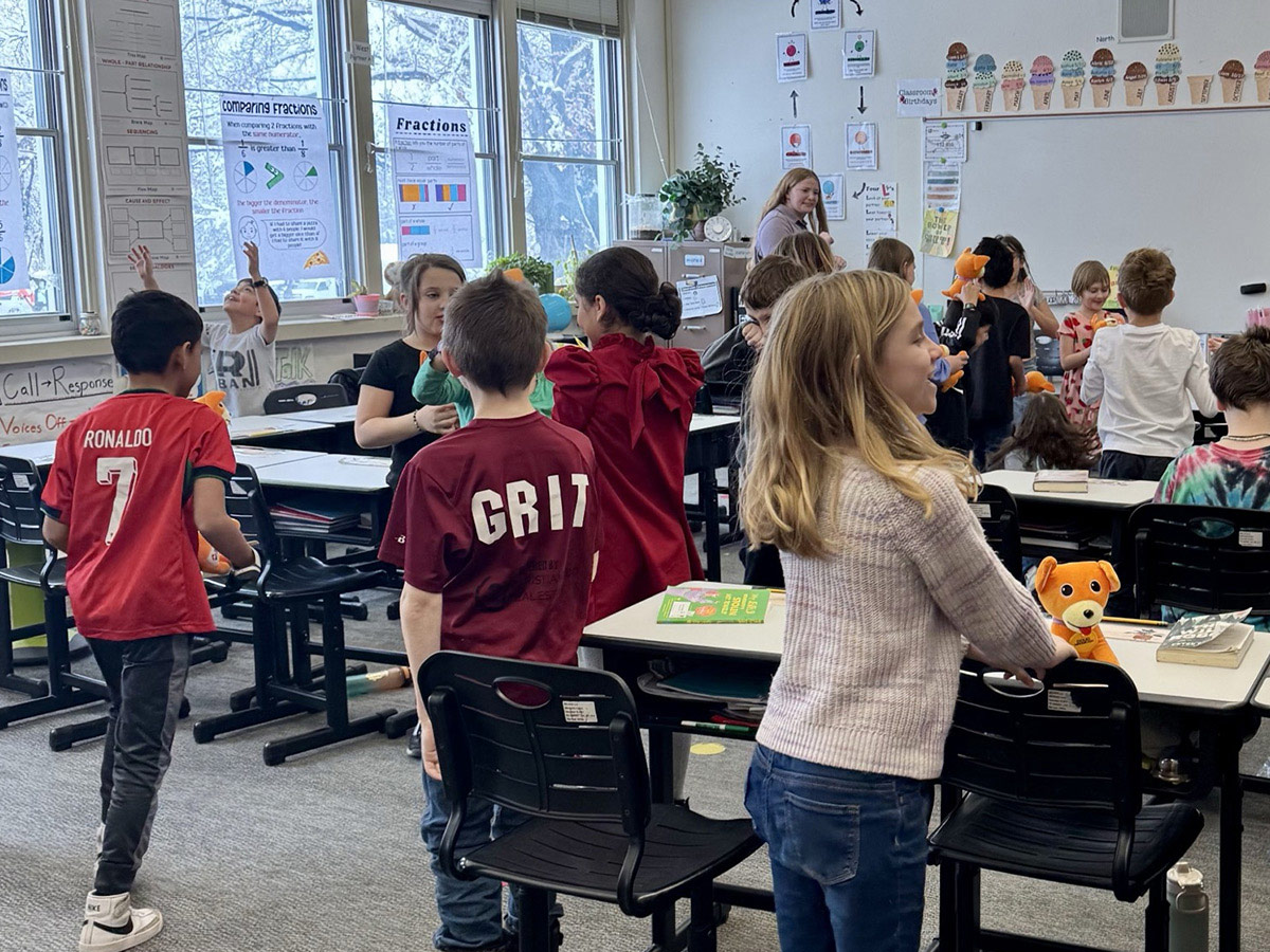 Photo of kids in a classroom with B3 merch