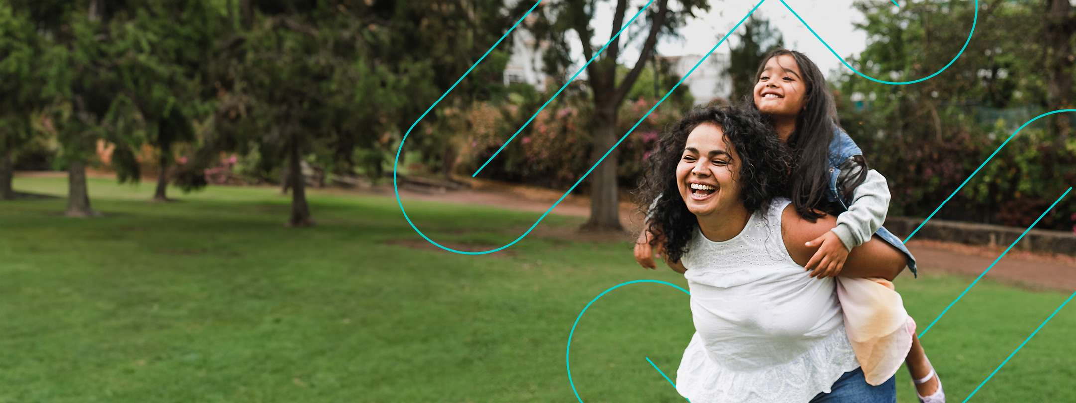 Photo of mom giving daughter a piggy back riding and smiling