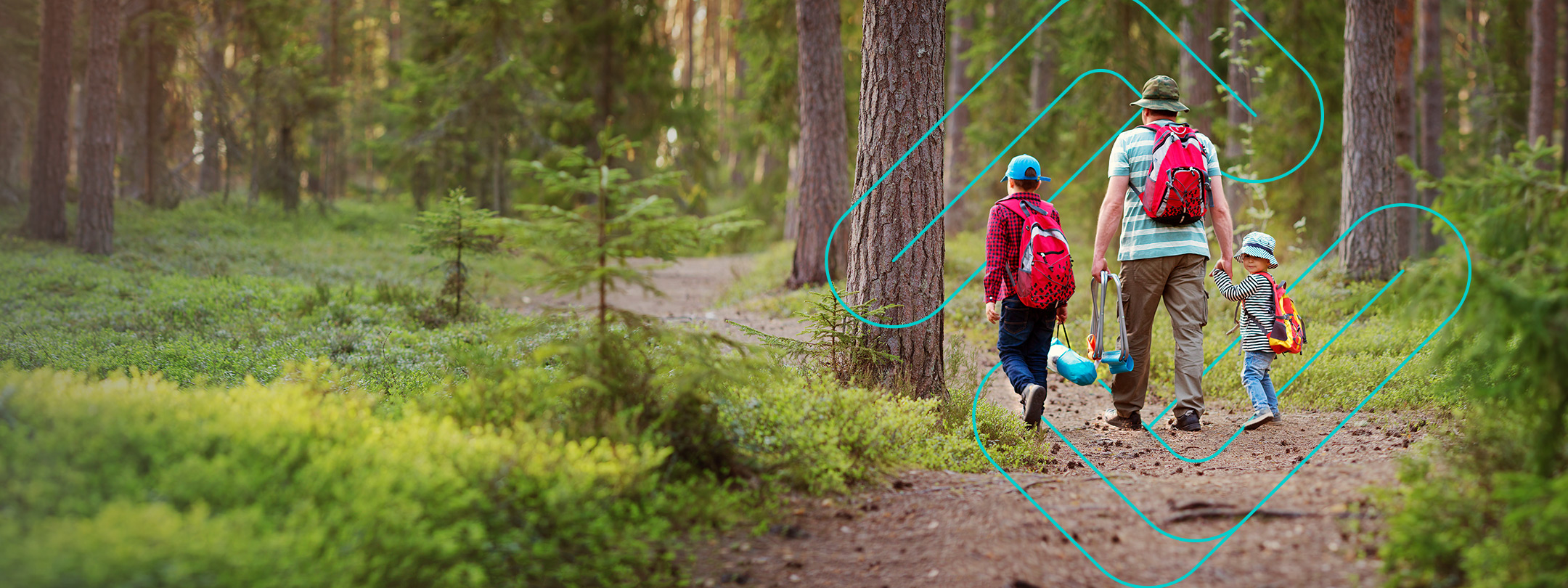 Father and two children hiking on trail, small child turns for the camera, outside, forest