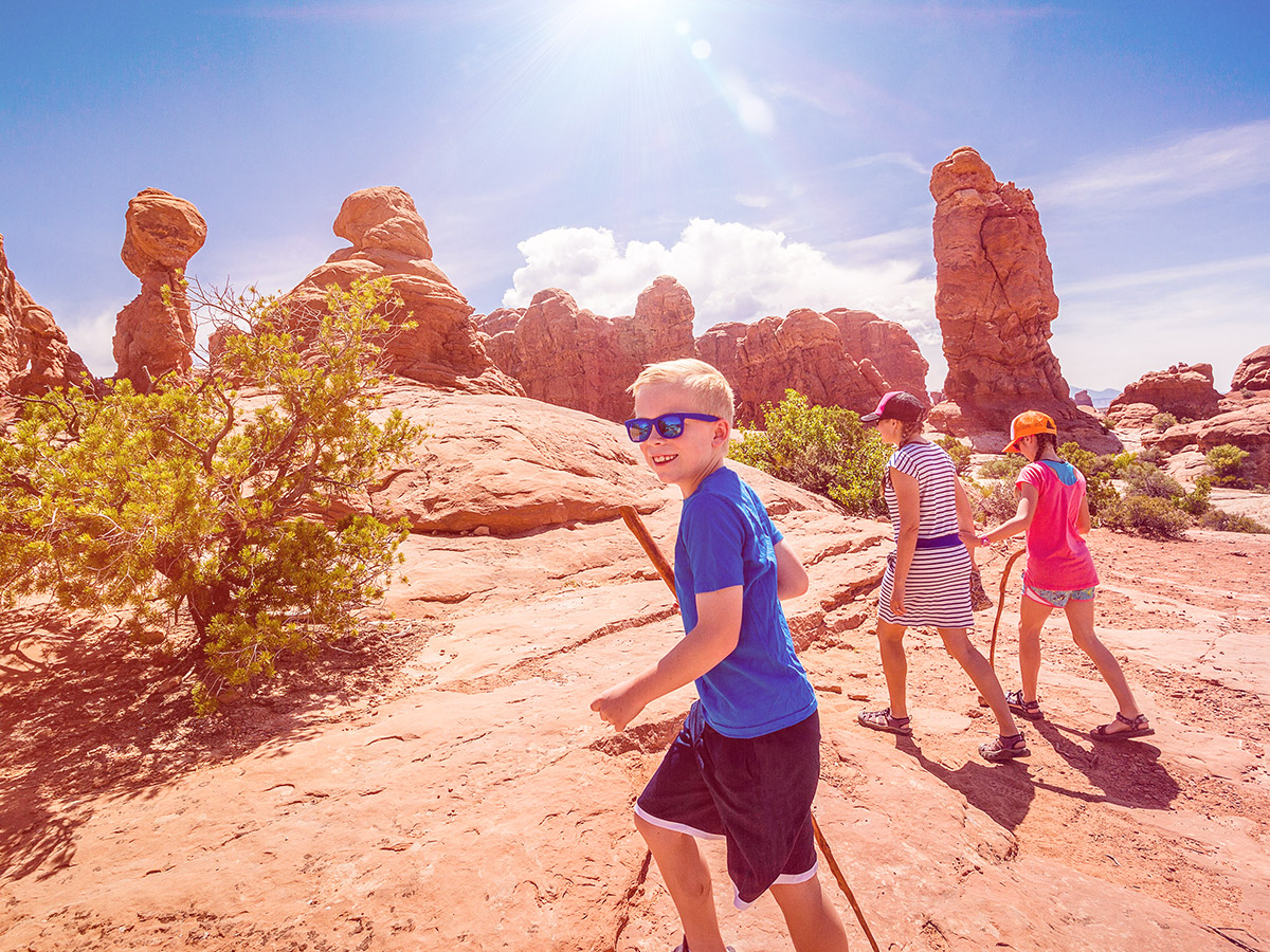 Family hiking in Arches National Park, Utah