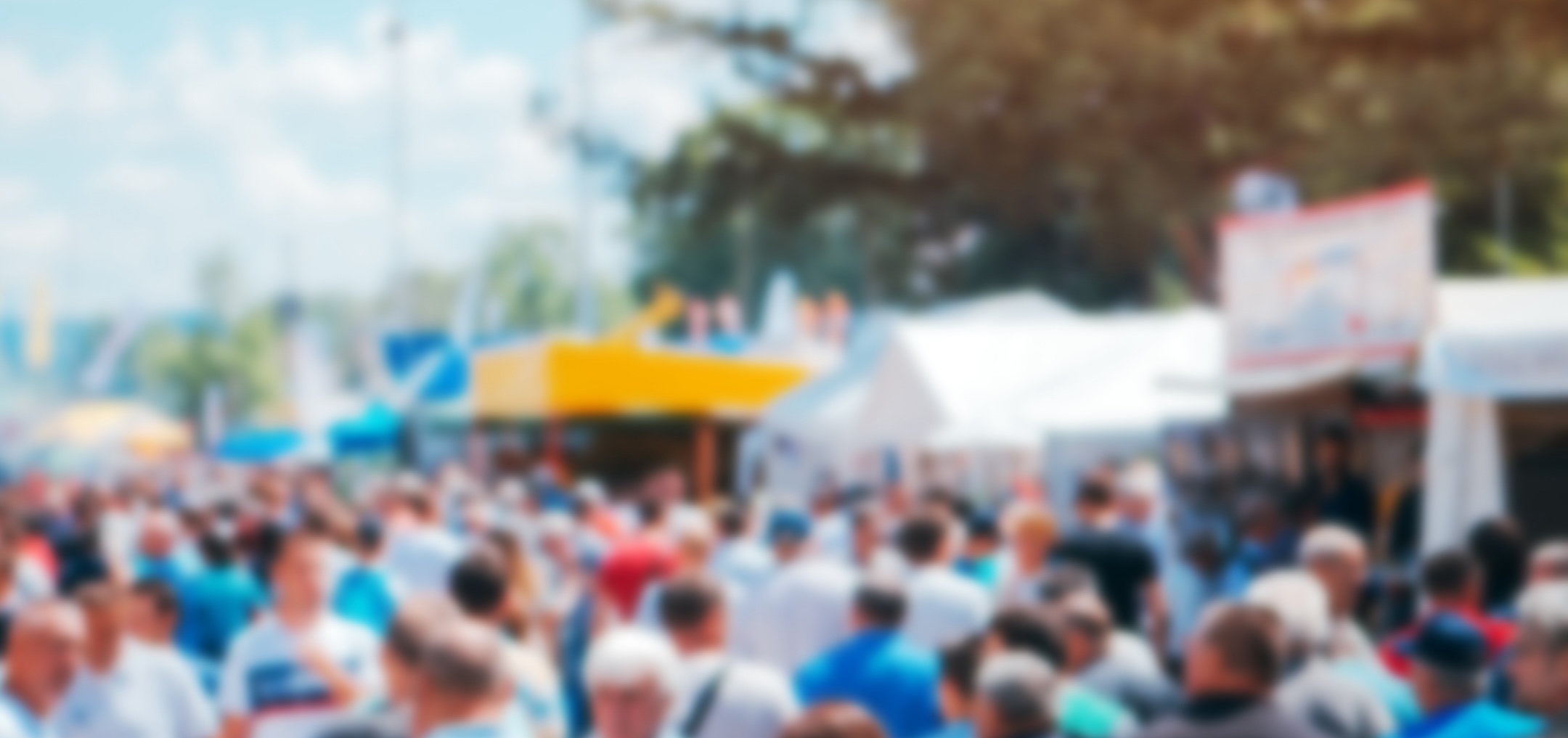 Crowd of people on open air festival, abstract blurred background as graphic design element